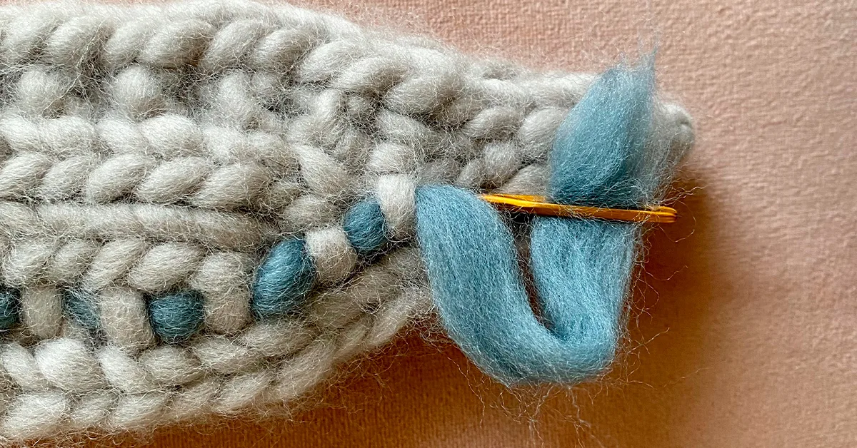 tapestry needle in the stitch